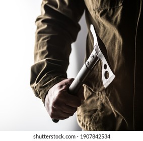 Man Holding A Black Tactical Tomahawk