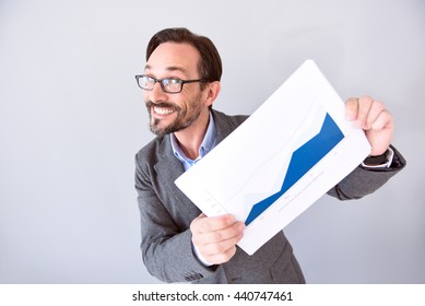 Man holding board with graph