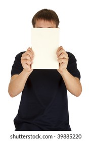 A Man Holding A Book Covering His Face