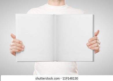 Man Holding Book On White Background