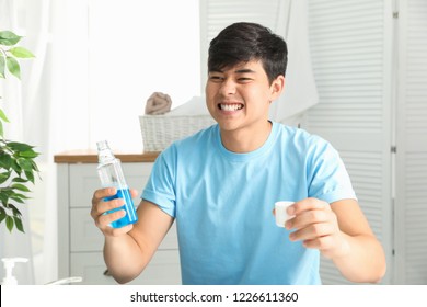 Asian man singing in bathroom commercial