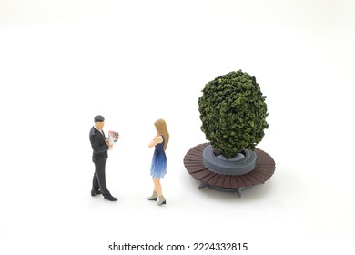 man holding bouquet of flower and give it to a woman