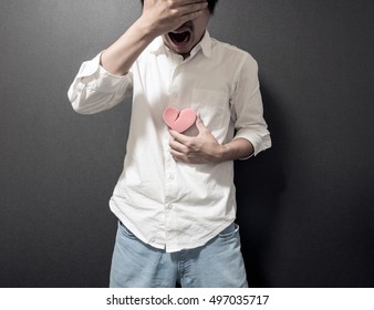 Man Holding Broken Heart