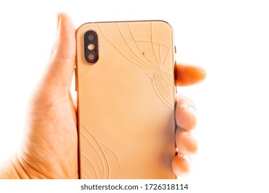 Man Holding Broken Phone On The White Background Isolated.