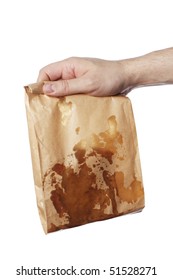 Man Holding A Brown Paper Bag With Very Greasy Contents