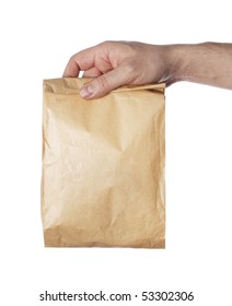 Man Holding A Brown Paper Bag In His Hand.