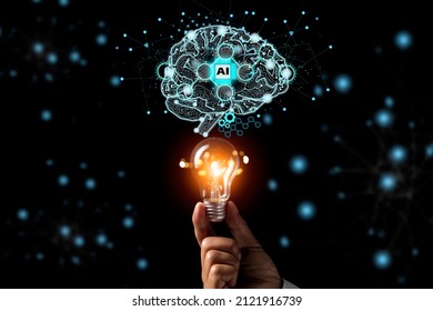 Man holding bulb lamp nad Brain with printed circuit board artificial intelligence AI