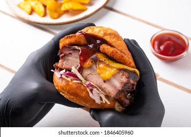 Man Holding  Burger In Arms. Eating Burger. Fast Food