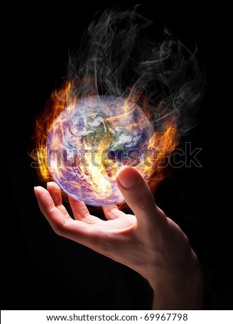 Man holding burning Earth in his hand as a symbol of global warming or an apocalypse. Earth globe image provided by NASA (http://visibleearth.nasa.gov/view_rec.php?id=2429).