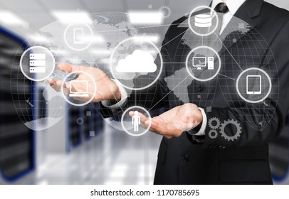 Man holding business elements icons on screen - Shutterstock ID 1170785695