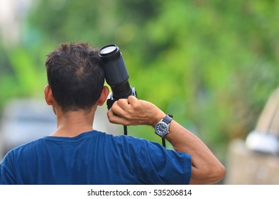 Man holding a camera.