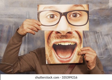 Man Holding A Card With A Big Smile And Big Glasses On It