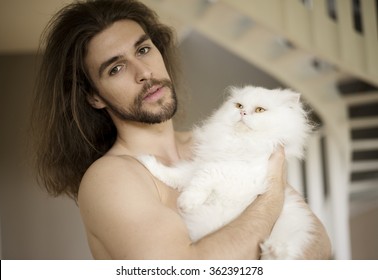 Man Holding A Cat