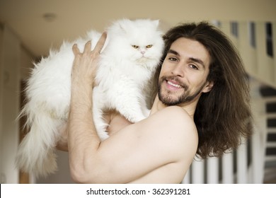 Man Holding A Cat