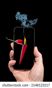 Man Holding A Cellphone With A Red Hot Chilli Pepper Lighter Concept On It