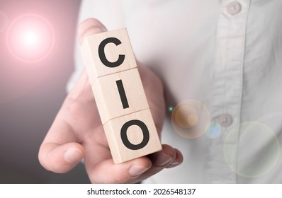 Man Holding Chief Information Officer Word On Wooden Cube.