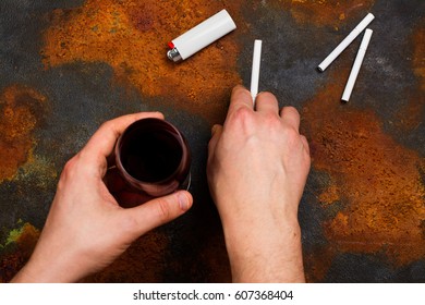 Man Holding Cigarette And Glass Of Red Wine In His Hands. Bad Unhealthy Habits Or New Year Resolution Concept. Copy Space