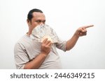 man holding a cloth fan
  in his hand while pointing