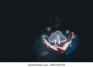 Man holding cloud icon with security symbols, representing cloud computing, data protection, and digital security concepts.
