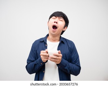 Man Holding Coffee Cup And Feeling Sleepy Gesture Yawn White Background