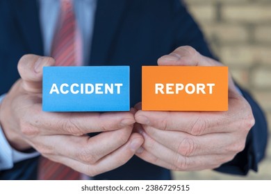 Man holding colorful blocks sees inscription: ACCIDENT REPORT. Concept of accident report. Claim injury compensation. Filling of accident report form.