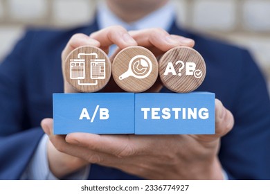 Man holding colorful styrofoam blocks sees inscription: A B TESTING. AB testing wireframe campaign for web website home homepage. AB Testing Method. Internet pages A-B comparison and split testing.