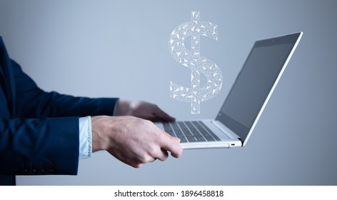 Man Holding Computer With Digital Dollar Signs