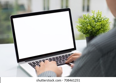 Man Holding Computer With Isolated Screen In Cafe