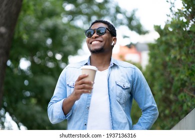 Man holding a cup of coffee.