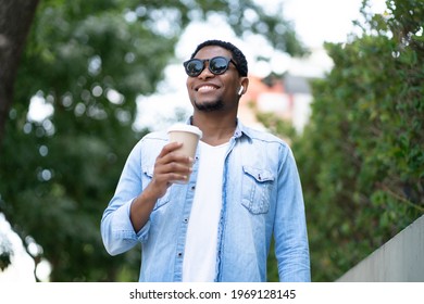 Man Holding A Cup Of Coffee.