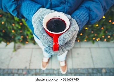 Man Holding Cup Of The Hot Wine At The Christmas Market - Munich, Germany - Selective Focus