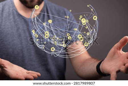 Man holding digital network sphere with connection lines.