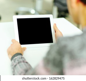 Man Holding Digital Tablet Computer