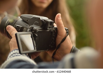 Man holding a DSLR camera