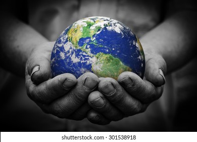 Man Holding An Earth Globe In His Hands. Earth Image Provided By NASA.