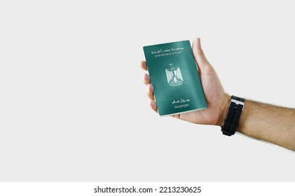 Man holding Egypt Passport in hand on white background with copy space - Egyptian - Shutterstock ID 2213230625
