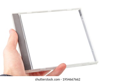 Man Holding An Empty Blank CD Or DVD Disc Box Container In Hand Isolated On White Background, Cut Out. Place For Own Music Album Cover Picture, Simple Creative Cover Image Placeholder Template, Mockup