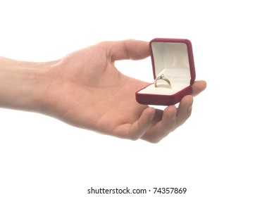 Man Holding An Engagement Ring In Red Box