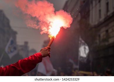 Man Holding Flaming Torch During Protest