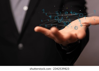 A man holding a floating digital render of a binary code network