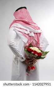 A Man Holding Flower Bouquet In Hands And Hiding Behind In Saudi Arabia Middle East Gulf