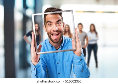 Man Holding A Frame