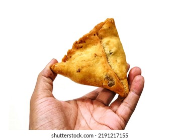 A Man Holding Fried Samosa In Hand Isolated On White Background