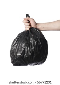 Man Holding A Full Black Plastic Trash Bag In His Hand.