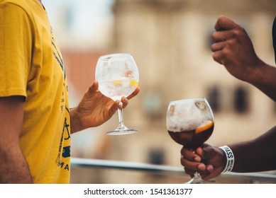 A Man Holding A Glass Of Tonic Gin