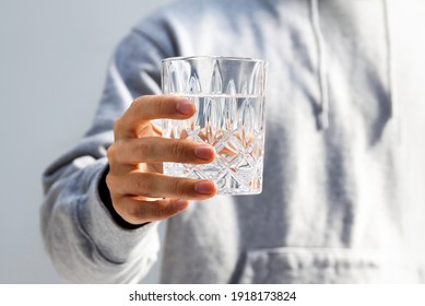 Man holding a glass of the water