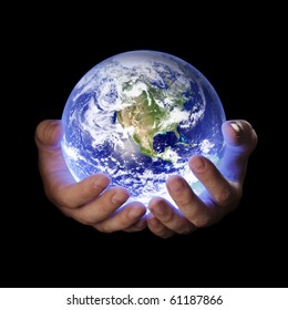 Man holding a glowing earth globe in his hands. Earth image provided by Nasa.