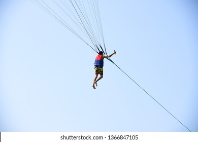 Man Holding Gopro Camera In Hand On Parachute Ride With Gopro Camera In Hand In Air Flight Background Blue Sky Travel Summer, Para Sailing In Pattaya City Thailand ,9th February 2019