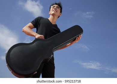 Man Holding Guitar Case