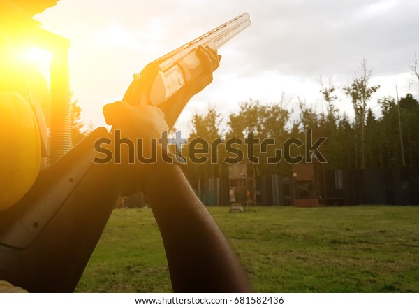 Man holding gun in\
street